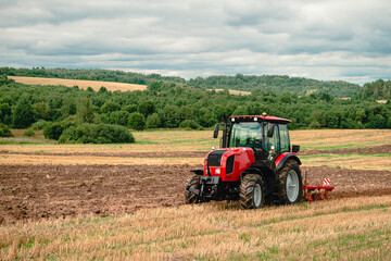 Fototapeta na wymiar Tractor with plow