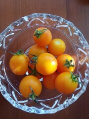 tomatoes in a crystal bowl in sunlight