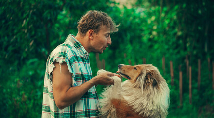 Man embracing his dog. Happy day. Fun. Funny photo. Dog. 
