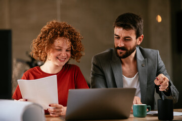 Businessman and businesswoman in office. Businesswoman and businessman working on the project..