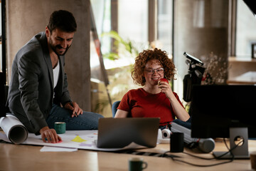 Businessman and businesswoman in office. Businesswoman and businessman working on the project..
