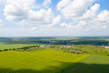 Panoramic top view of farmland, view of the контросиде. Shadow of clouds on the fields