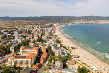 Suny Beach, Bulgaria - August 09, 2019: Aerial image drone resort in Bulgaria on Black Sea coast. Many hotels and beaches with tourists, sunbeds and umbrellas. Sea travel destination