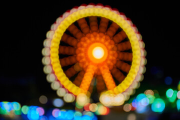 Carousel at night with blurry lights.