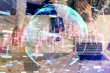 Double exposure of man and woman working together and financial chart hologram drawing. market analysis concept. Computer background. Top View.