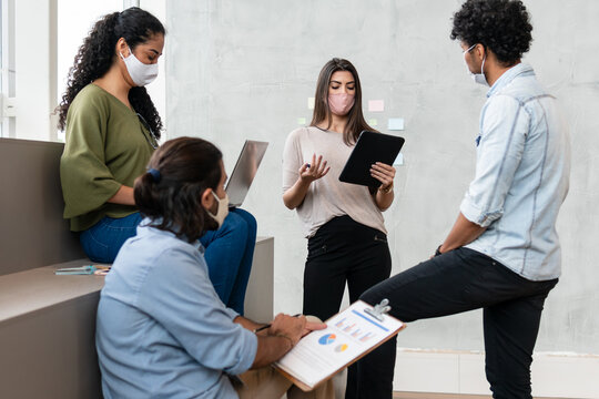 Confident Brazilian Female Boss With Tablet Presenting Project At Meeting In Office Or Coworking Space. Connection, Workplace, Networking, Concept..