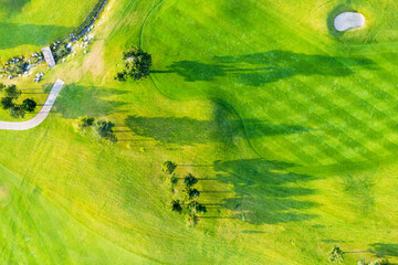 Aerial view of a green golf course in Bansko, mountain resort in Bulgaria. Golf course as background. Travel and vacation concept.