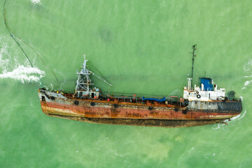 Top view of sinking tanker shot by drone. Inverted tanker wrecked on Black Sea coast of Odessa....