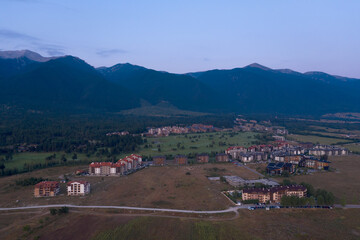 Fototapeta na wymiar Aerial view from the drone. Stunning mountain and countryside view shot from a drone in the morning at dawn. Beautiful landscape of sunrise in the mountains
