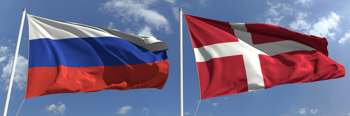 Flying flags of Russia and Denmark on high flagpoles. 3d rendering