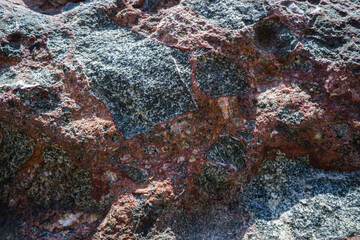 Colorful rock texture. Natural cracks void.