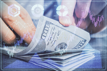 Multi exposure of forex graph drawing hologram and USA dollars bills and man hands. Technical Analysis concept.