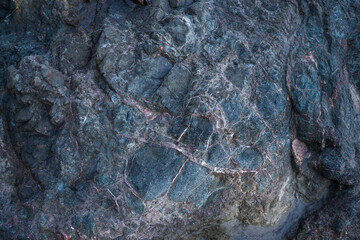 Colorful rock texture. Natural cracks void.