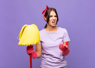 young pretty woman looking angry, annoyed and frustrated screaming wtf or what‚Äôs wrong with...