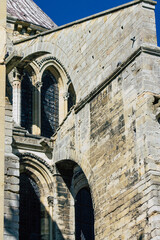 Fototapeta na wymiar View of the exterior facade of the Basilica of Saint-Remi, a medieval abbey church in Reims, a historical monument in the Grand Est region of France 