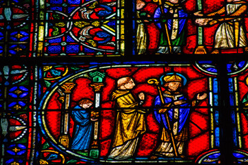 View of stained glass windows inside the Basilica of Saint-Remi, a medieval abbey church in Reims, a historical monument in the Grand Est region of France  
