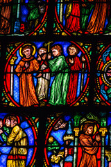 View of stained glass windows inside the Basilica of Saint-Remi, a medieval abbey church in Reims, a historical monument in the Grand Est region of France  
