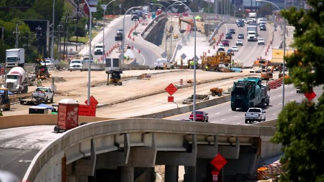 Traffic passing highway construction site, Dallas, Texas, United States