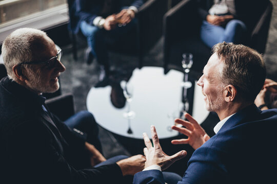 Businessmen discussing at workplace