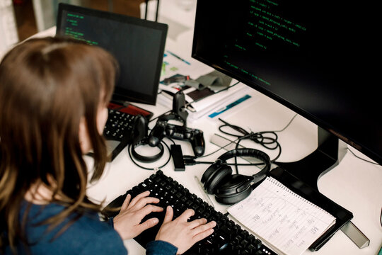 Female entrepreneur working on programming at workplace