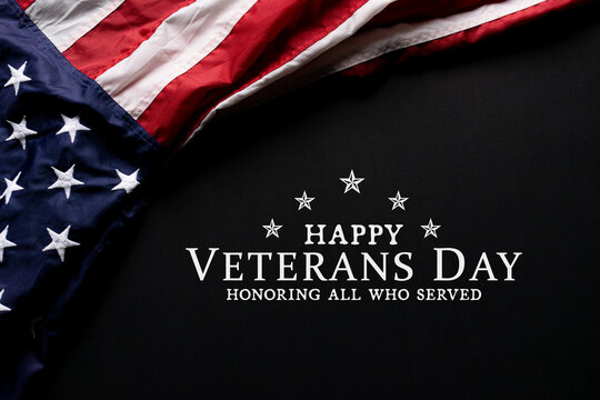 Happy Veterans Day. American flag on black background with copy space.