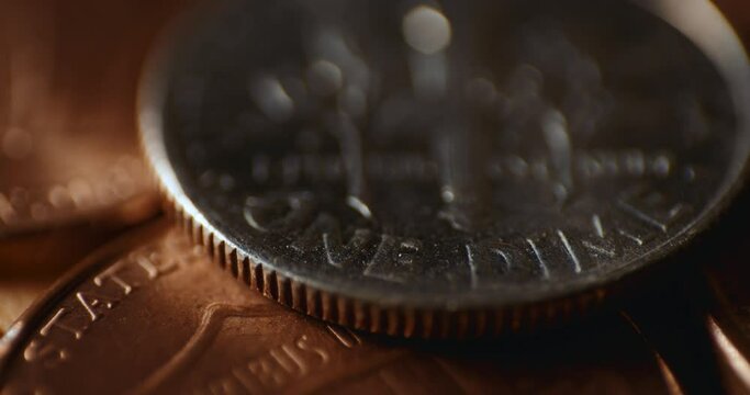 Macro close up of US dime coin with shining light