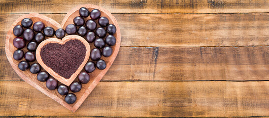 Acai powder and fresh berries from the Amazon - Euterpe oleracea