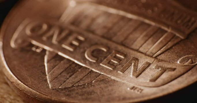 Macro close up of US one cent coin with shining light
