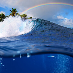 Perfect tropical ocean view splitted by waterline to two part. Shorebreak  breaking surfing wave....