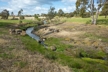A small creek/waterway in a large public park. Australian nature landscape. Hoppers Crossing Drain,...