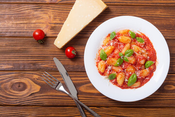 Italian homemade potatoes gnocchi with tomatoes sauce