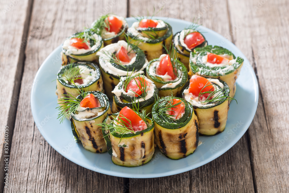 Wall mural zucchini rolls with cream cheese , tomatoes and dill