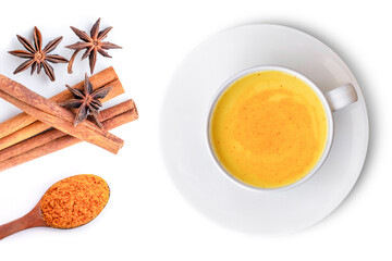 Golden tumeric milk, tea ( turmeric latte ) in white ceramic cup with curcumin powder and cinnamon spice isolated on white background. Top view. Flat lay.