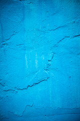 Blue paint painted on rough wall background