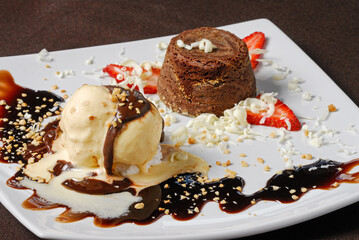Petit gateau is a dessert made up of a small chocolate cake and creamy filling served with ice cream.