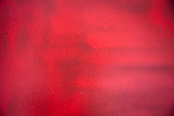 Red paint painted on rough wall background