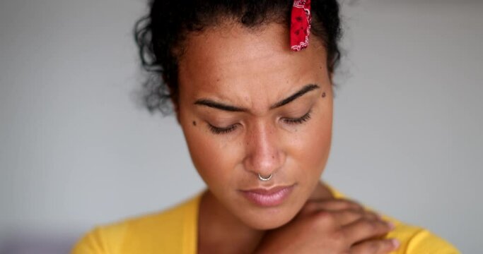Worried young black woman. Close-up depressed girl face thinking