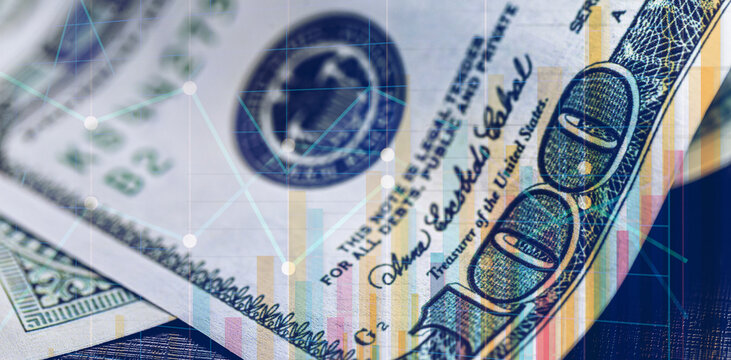 conceptual image on stock exchange, detail of 100 dollar bill in the background with graphs and bars