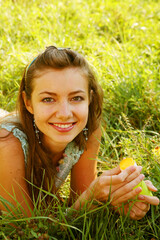 young woman outdoor in the grass in summertime