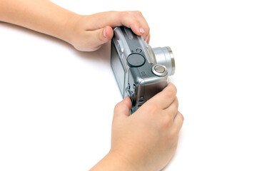 Kid hands hold digital old camera soap box on isolated white background, kid's hobby concept, learning journalism, paparating, photographing, child learning to photograph