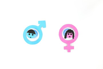 Flat lay of blue male symbol and pink female symbol side by side. Marriage, gender equality, feminine versus masculine, man vs woman concept.