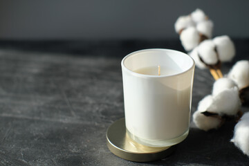 natural organic candle in unbranded white glass. scented candle for home aromatising and cozy...