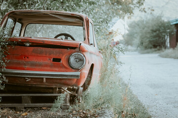 Obraz na płótnie Canvas abandoned, old car near the road