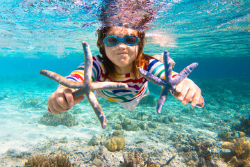 Child snorkeling. Kids underwater. Beach and sea.