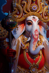 Idol of God Ganesha , Durga Puja festival at night. Shot under colored light at Howrah, West...