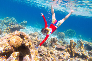 Child snorkeling. Kids underwater. Beach and sea.