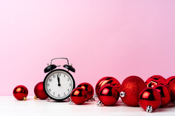Christmas and New Year countdown concept with alarm clock