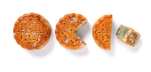 translation of the Chinese to English-lotus seed paste with yolk-top view moldy mooncake and slices on white no logo or trademark