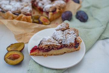sweet home made plum crumble pie on a table