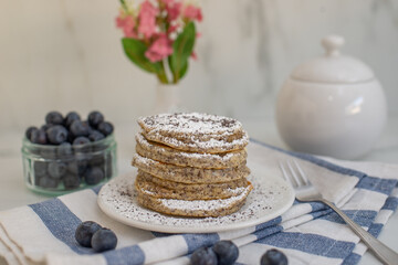 Home made lemon pancakes with poppy seeds on a breakfast table